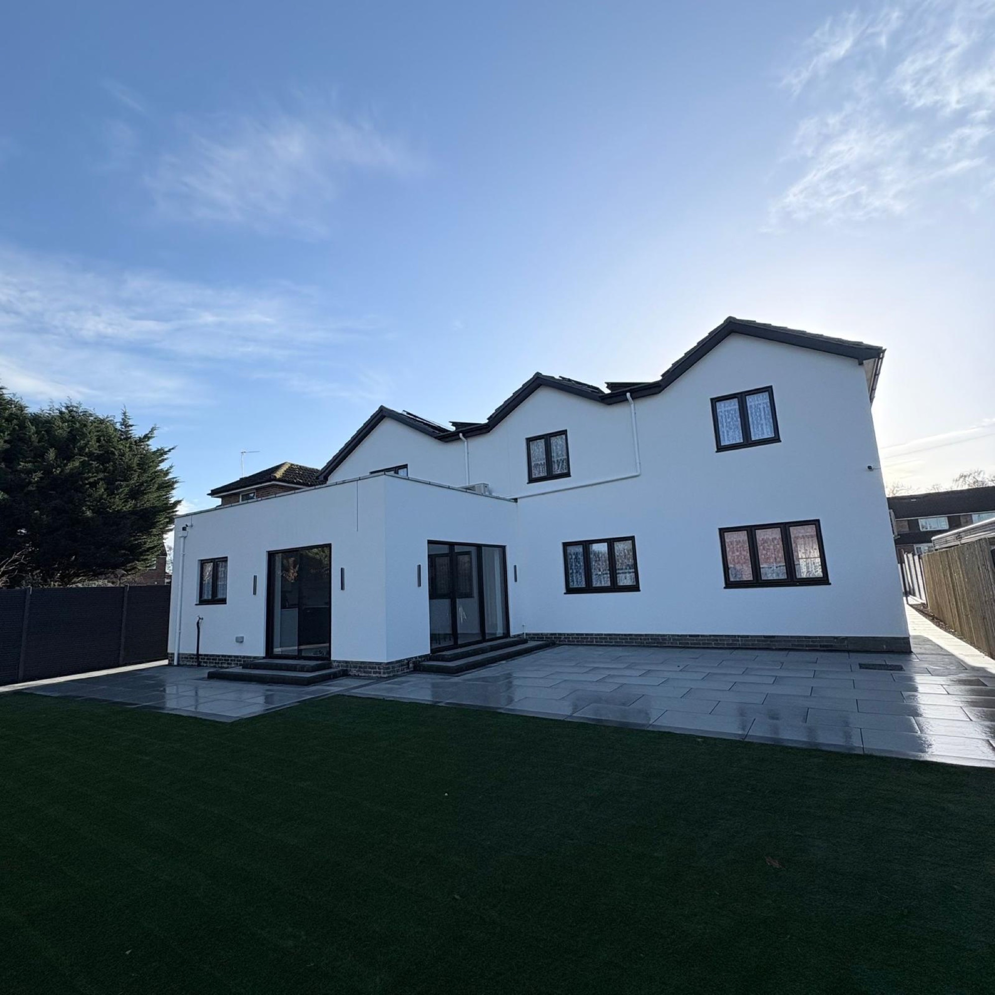 Fareham new build — rear elevation with patio and lawn