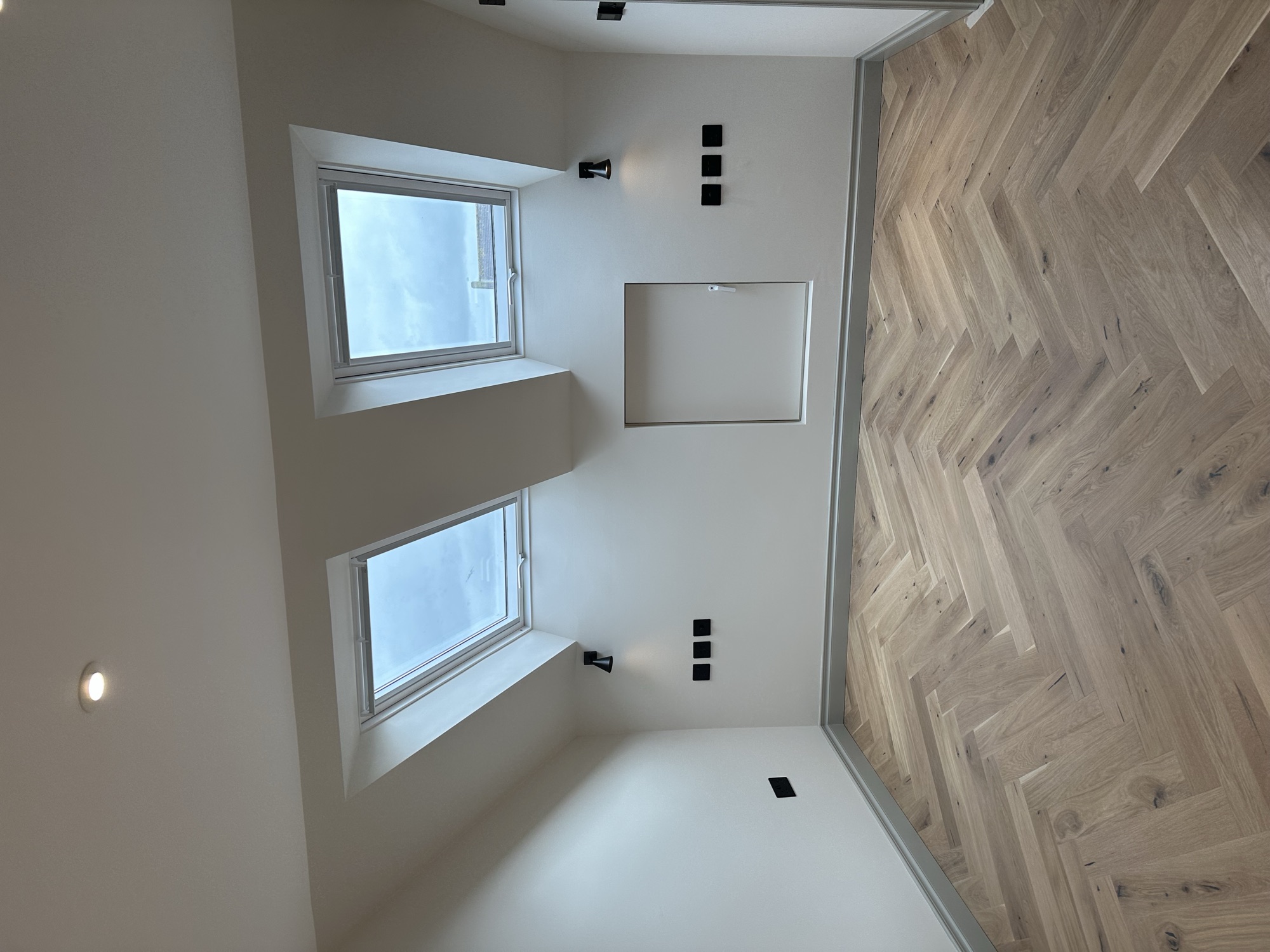 Portsmouth terrace house — loft bedroom with twin skylights and herringbone oak floor
