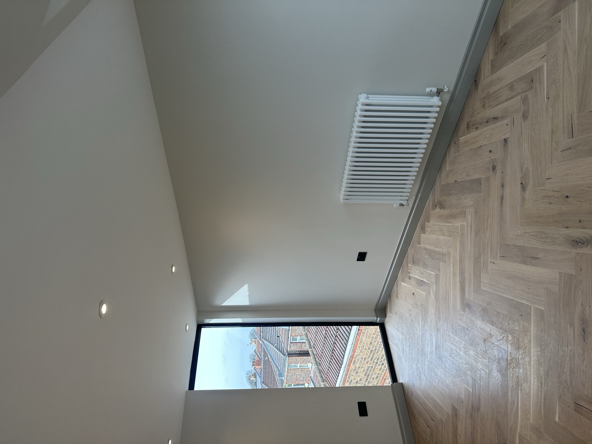 Portsmouth terrace house — loft room with full-height window