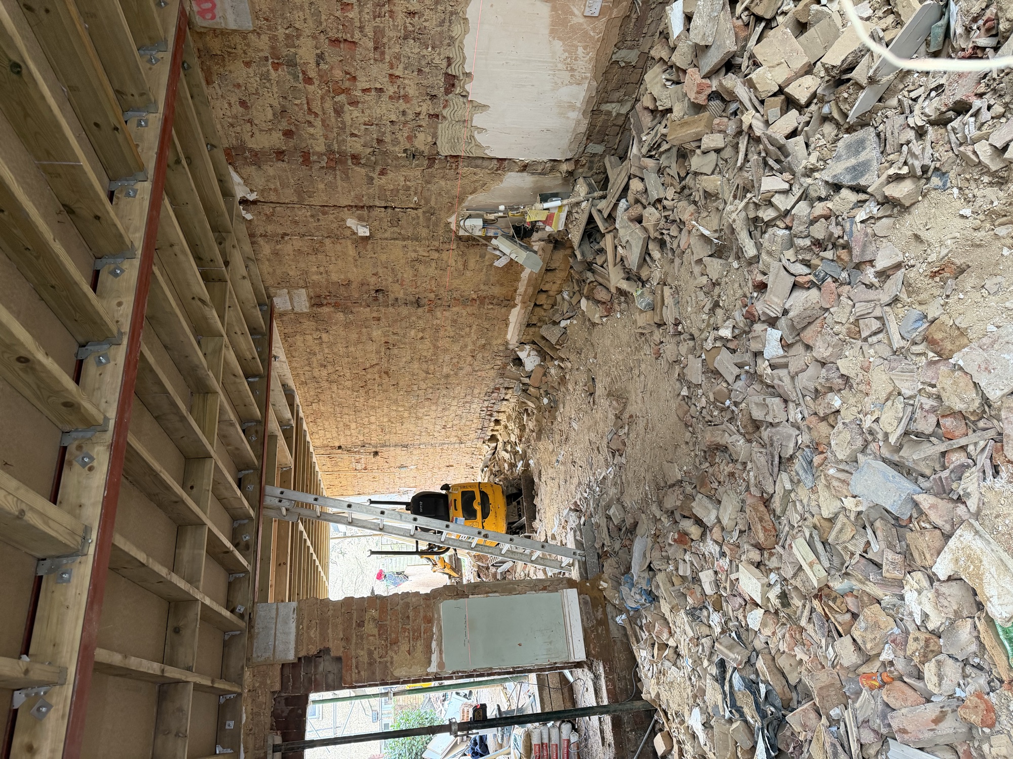 Southsea HMO conversion — interior stripped back to brick with new floor structure